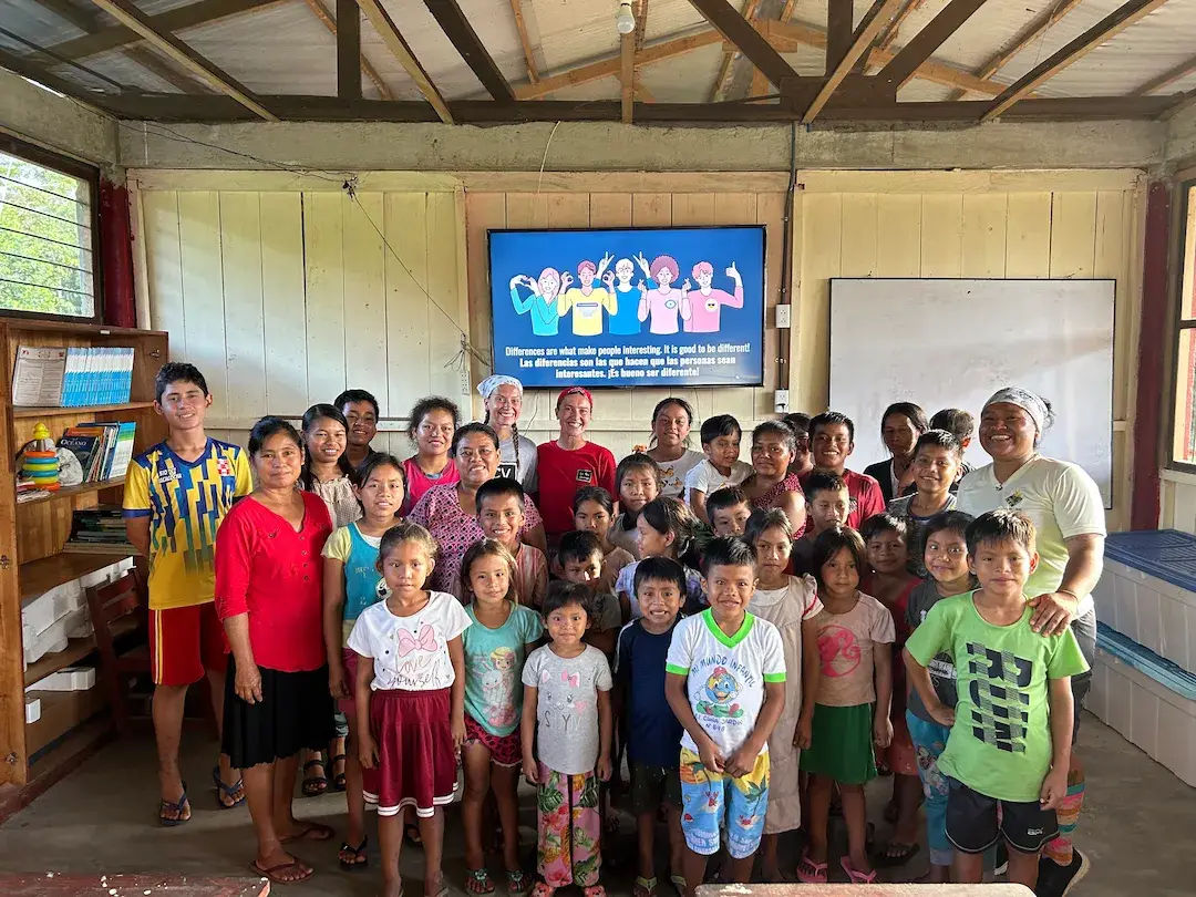 Children and volunteers sharing a happy moment.
