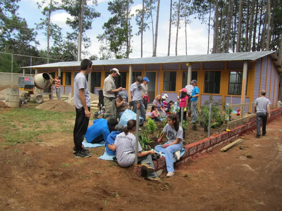 Volunteers and students working in the BTCV garden.