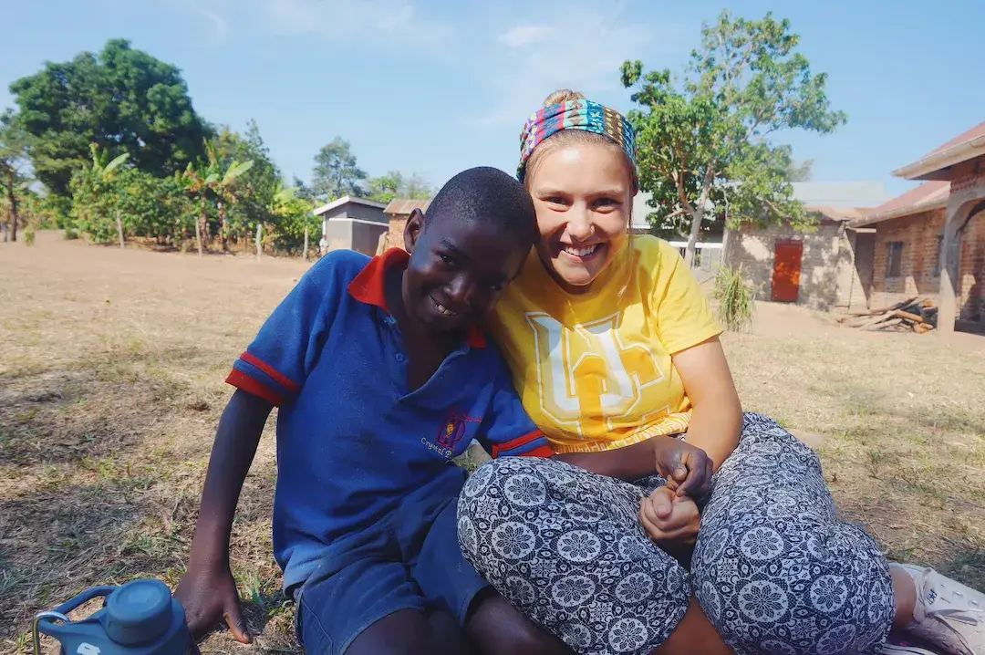 Volunteer Maddy supporting a student.