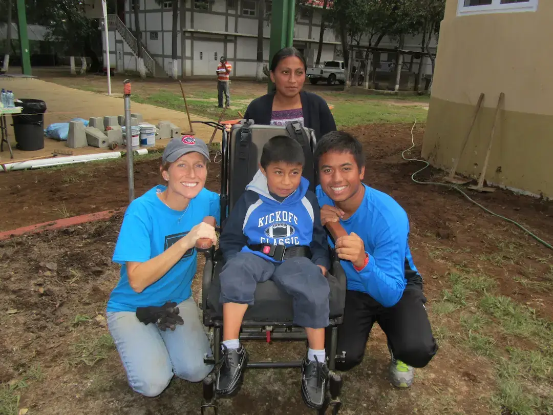 A volunteer helping a child during a BTCV-SPED session.
