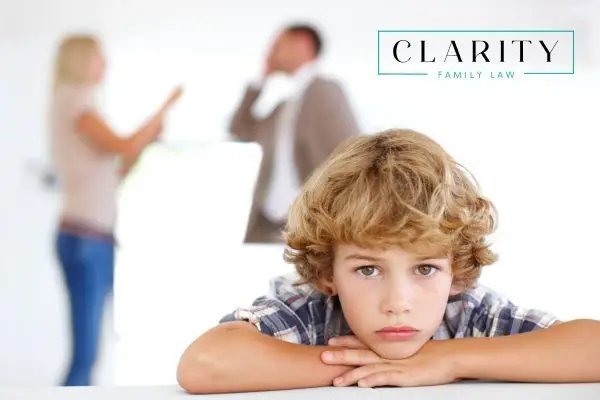 a child listening to his parents fight over custody