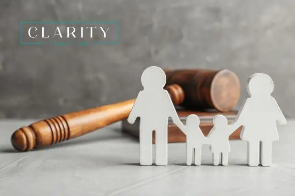 a cutout of a family holding hands with a gavel in the background
