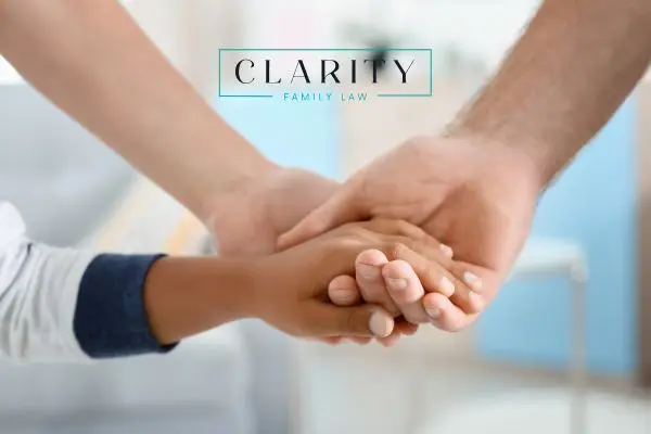 a stepchild holding the hands of a stepparent