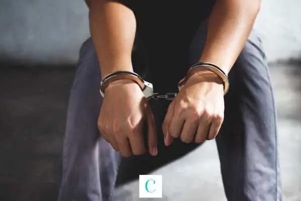 a man handcuffed for domestic violence