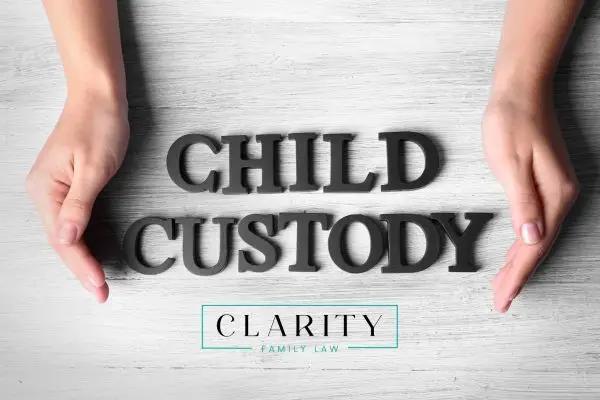 Child custody being spelled out in between a person's hands