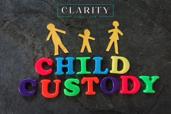 The words CHILD CUSTODY are spelled out in colorful plastic letters