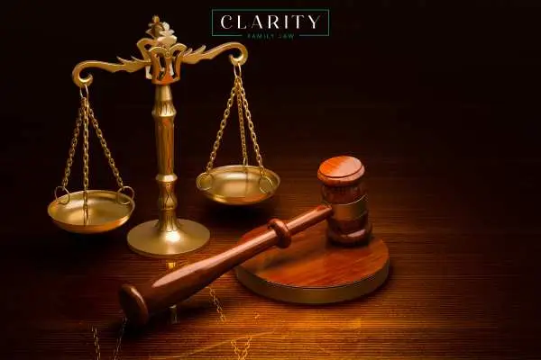 a gavel and scales of justice on a wooden table