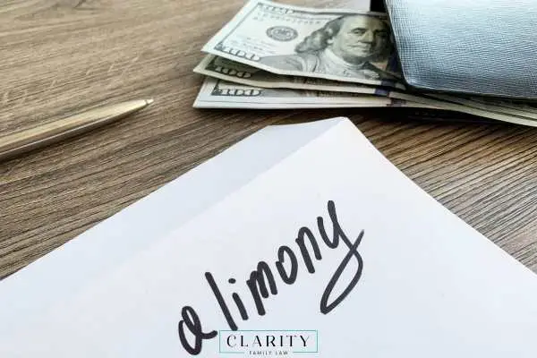 an envelope and alimony payment on a desk