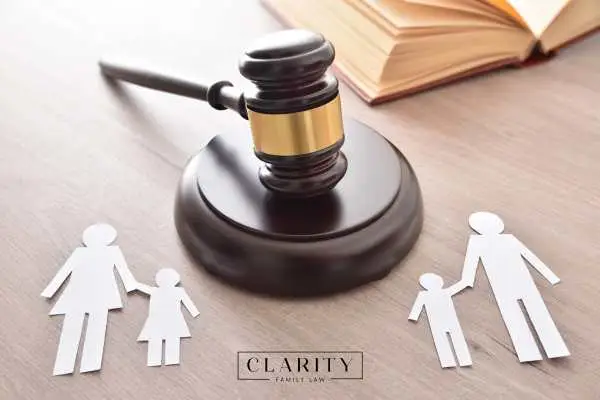 a gavel and family cutout on a lawyers desk