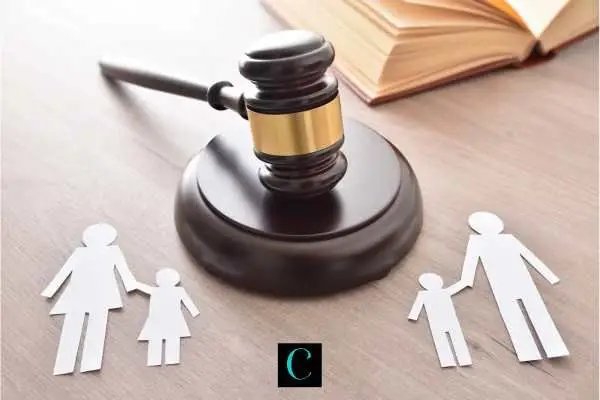 a cut out of a family being split by a gavel