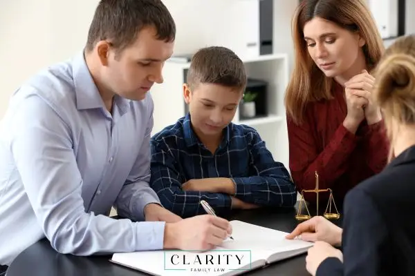 A mother, father, and son meeting with a legal professional