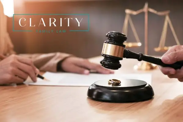 Gavel hitting a stand with wedding rings
