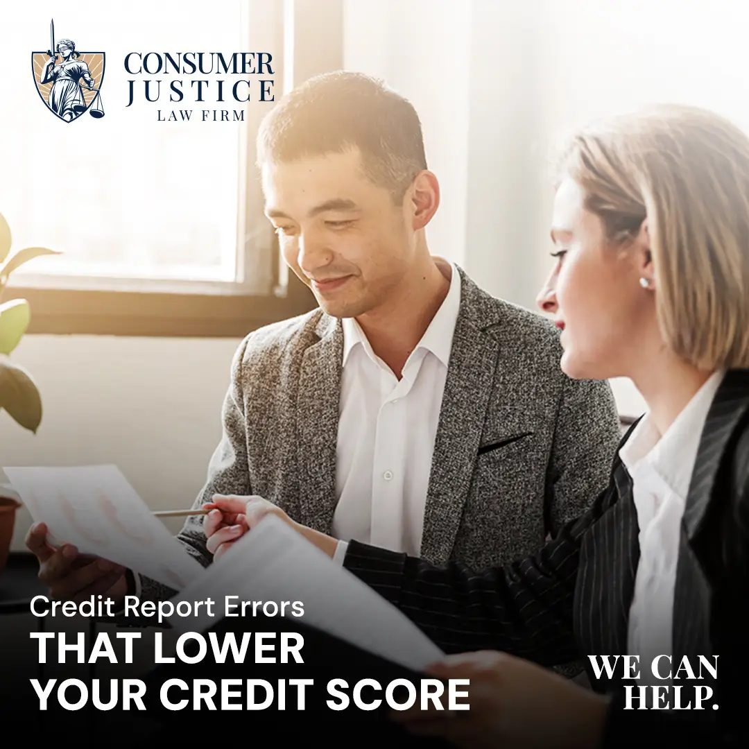 A credit report lawyer reviews documents with a client.