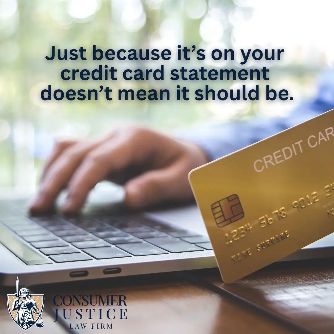 Someone on a laptop spots fraud and has to dispute credit card charges.