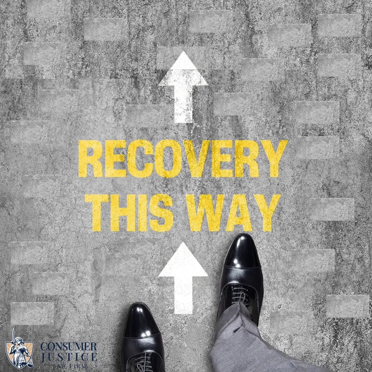 A man steps over the words Recovery this way painted on the street. It conveys that working with a lawyer for identity theft is the right direction.