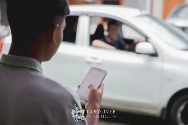 an uber driver picking a passenger up
