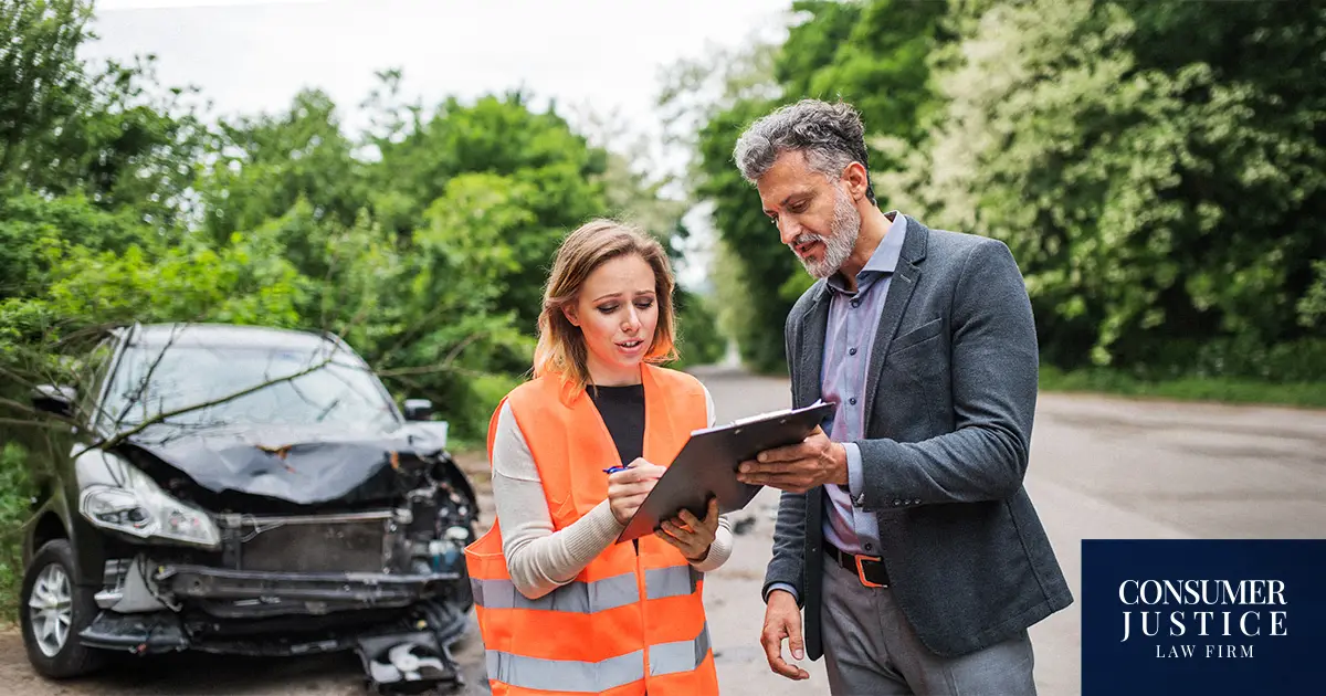 A man hopes his car insurance report is accurate following an accident.