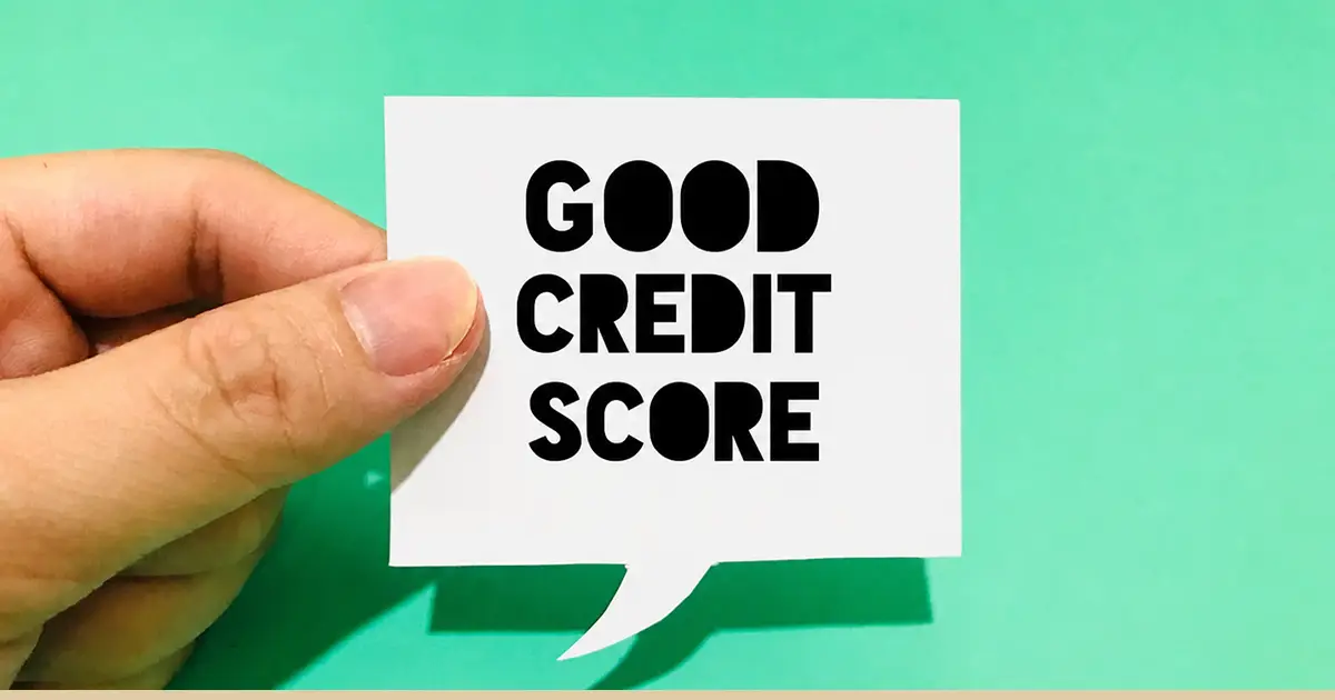 The words "good credit score" on a piece of paper.