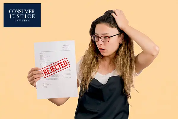 A woman is worried after getting rejected from a job.