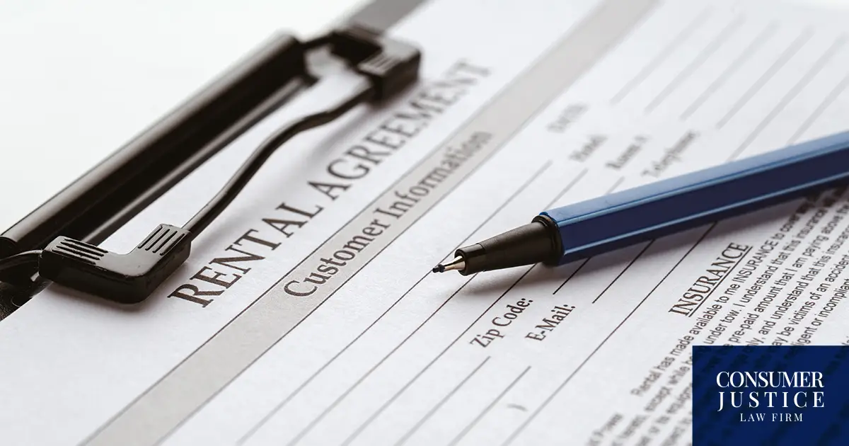 A rental application is being filled out.