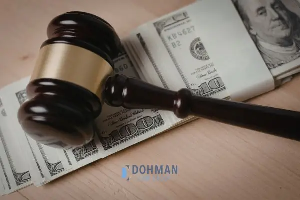 Judges gavel on top of a stack of bills