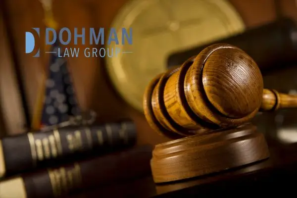 a judge's gavel and books sitting at their stand