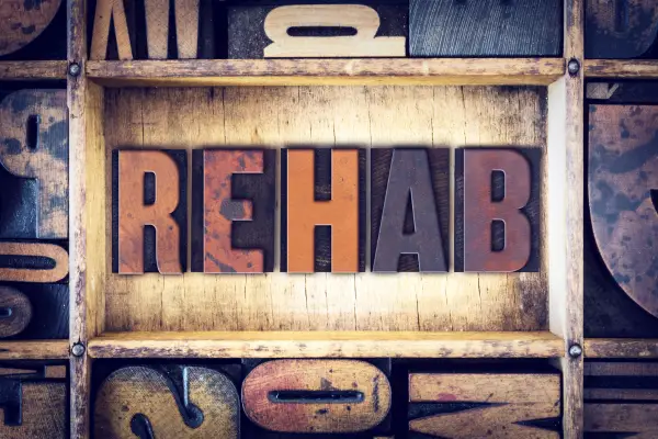 a sign that reads "REHAB"