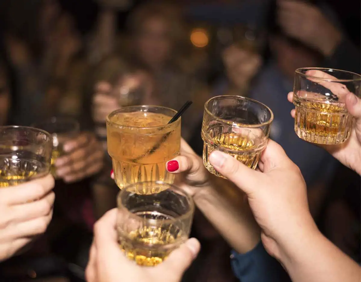 a group of young people drinking