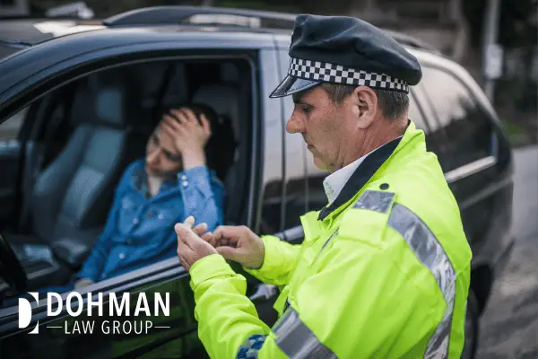Policeman stopping a women for DUI.