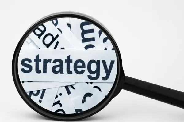 Magnifying glass over the word "strategy.