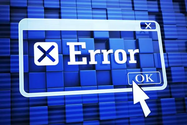 The image displays a blue and white "Error" pop-up window with an "OK" button, being clicked by a cursor, set against a background of blue 3D blocks.