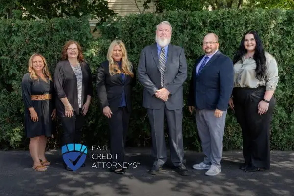 team of attorneys standing together outside