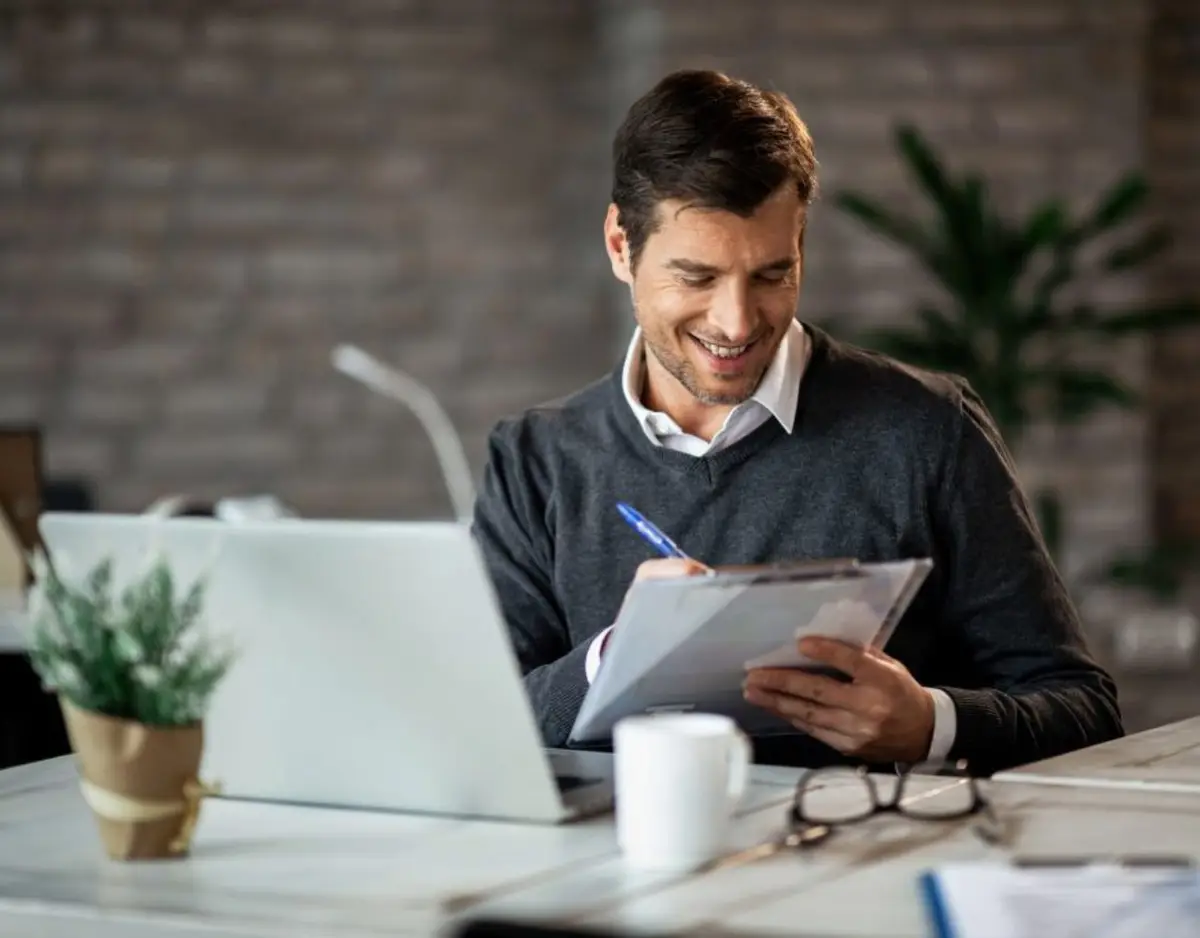 male gathering documents for his credit report