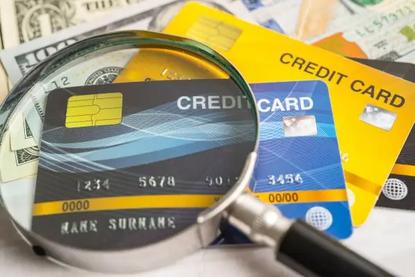 credit cards with magnifying glass on top
