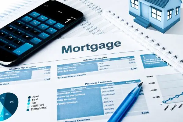 mortgage application with blue house on top right and calculator on left