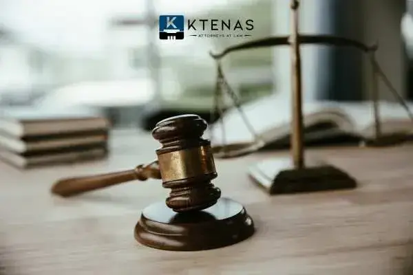Gavel with a scale of justice in the background
