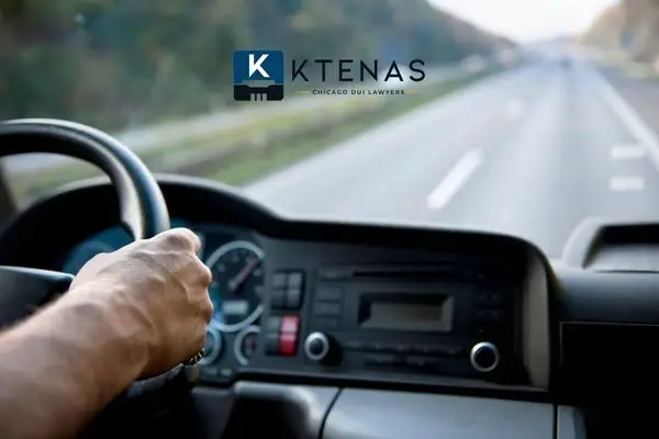 a man driving a commercial vehicle on a highway