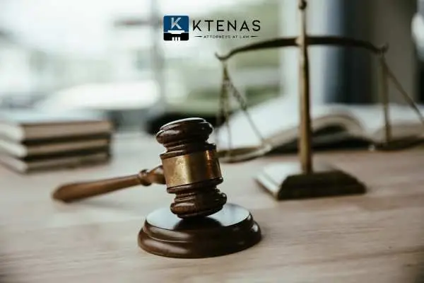 Gavel with a scale of justice in the background