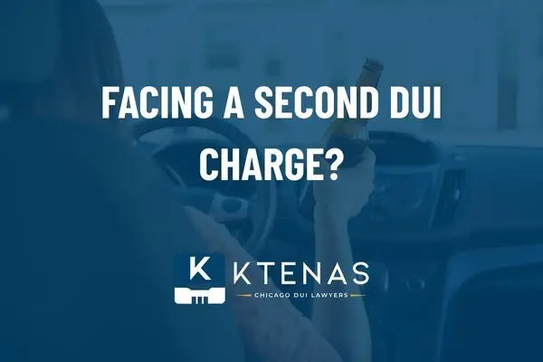a person in a driver's seat holding a beer bottle. And the words second DUI