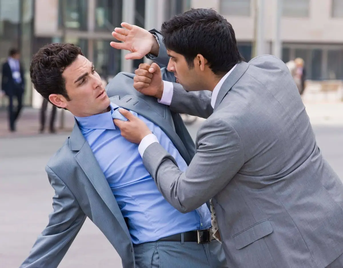 two men in suits fighting