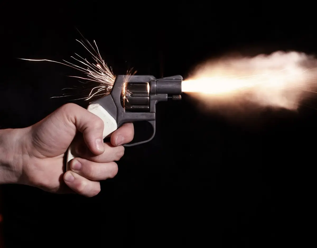 shooting gun showing spark