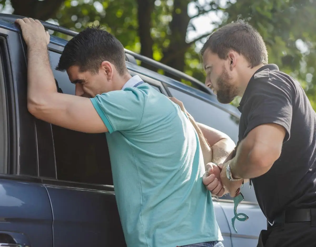 man getting arrested by police officer