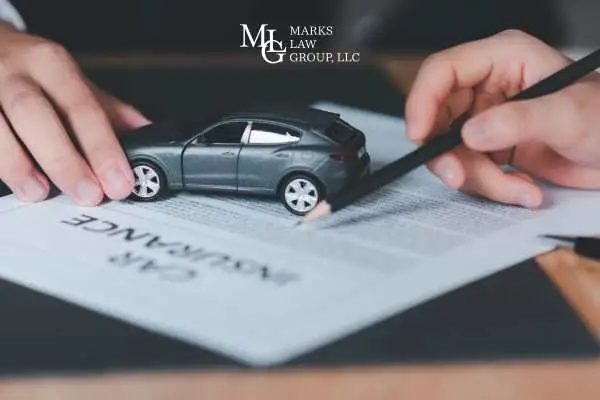 a man reviewing a car insurance policy