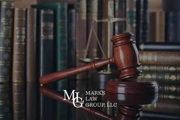 gavel in front of stack of books