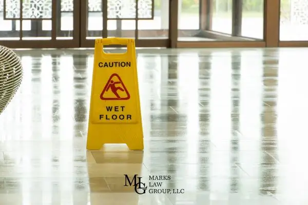 a wet floor sign in a hotel lobby