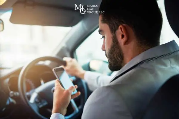 a man texting while driving