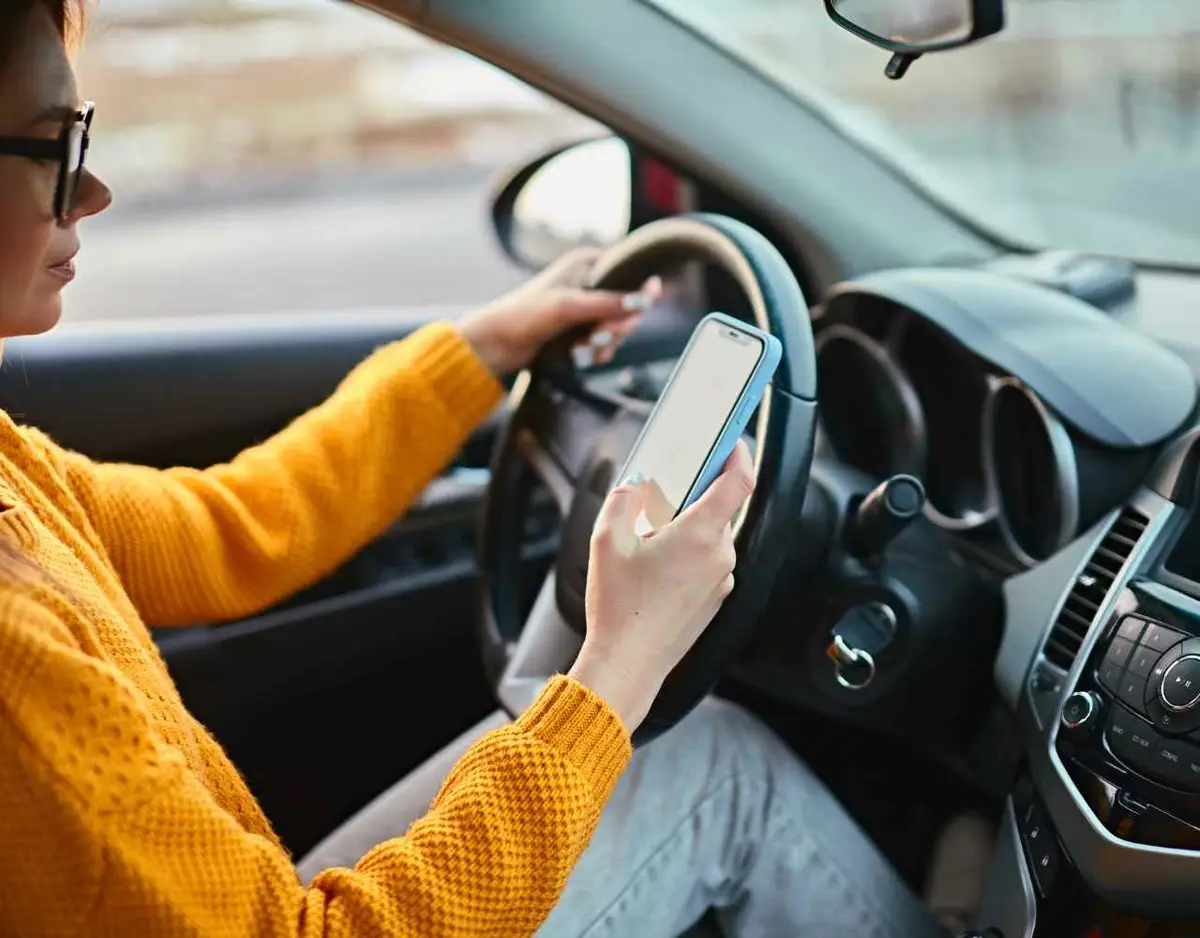 a woman on her phone while driving