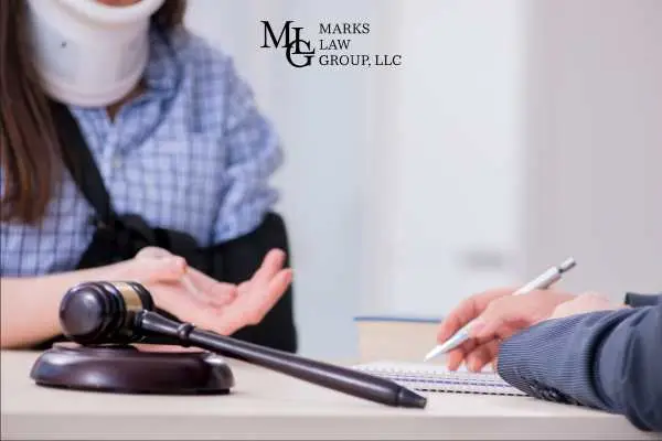 a woman speaking about an injury claim to a lawyer