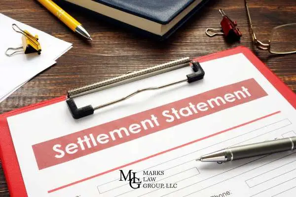 a settlement offer from an insurance company on a clipboard