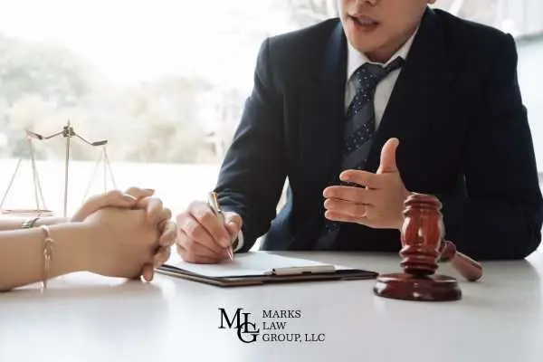 a person discussing pursuing an injury claim with an attorney